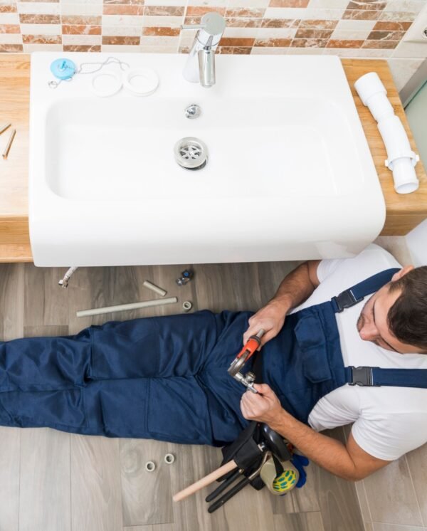 sanitary-technician-working-with-sink_23-2147772219 sanitary-technician-working-with-sink_23-2147772219